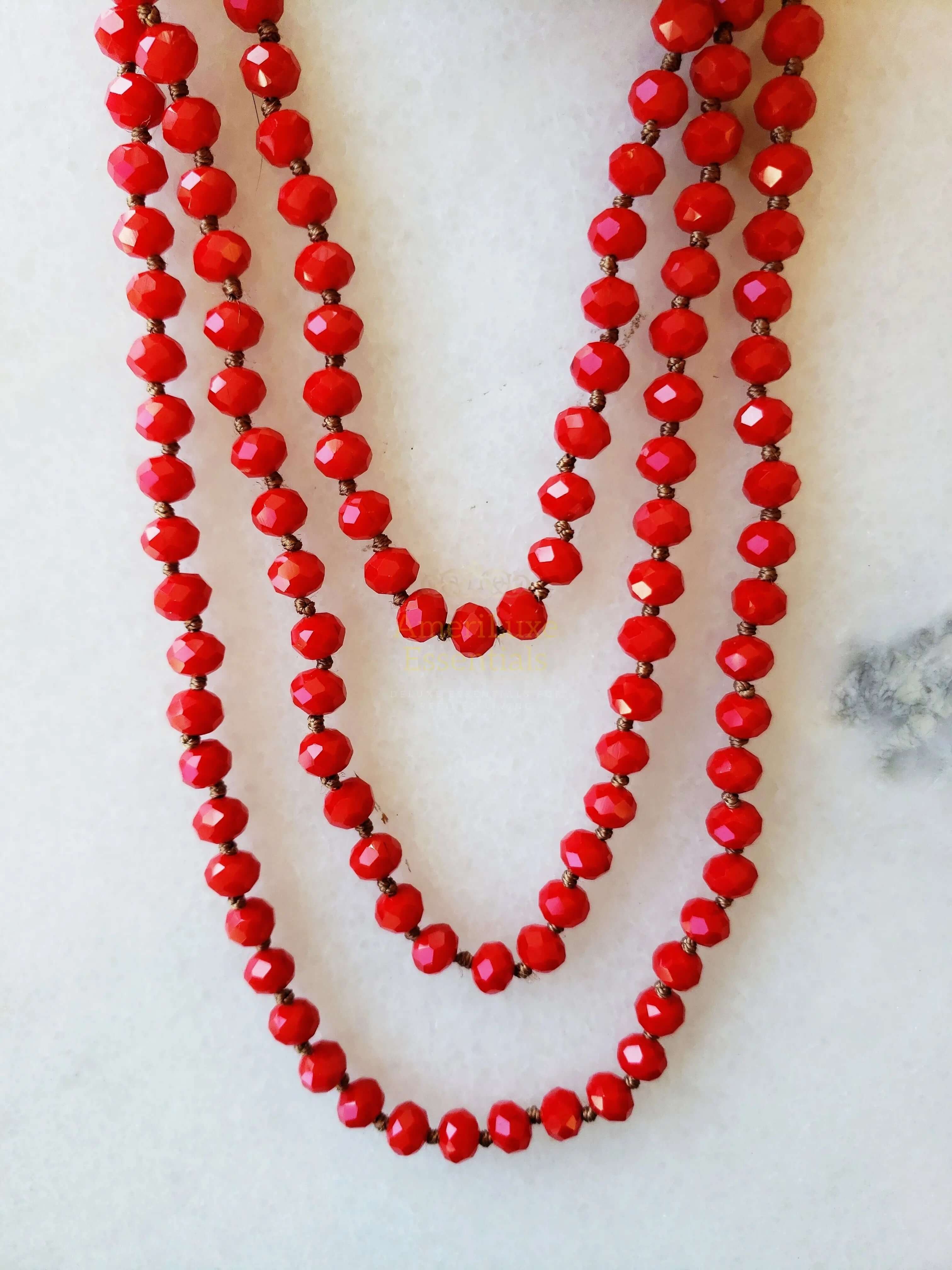 cherry red crystal necklace featuring multiple strands of crystal beads reflecting light elegantly