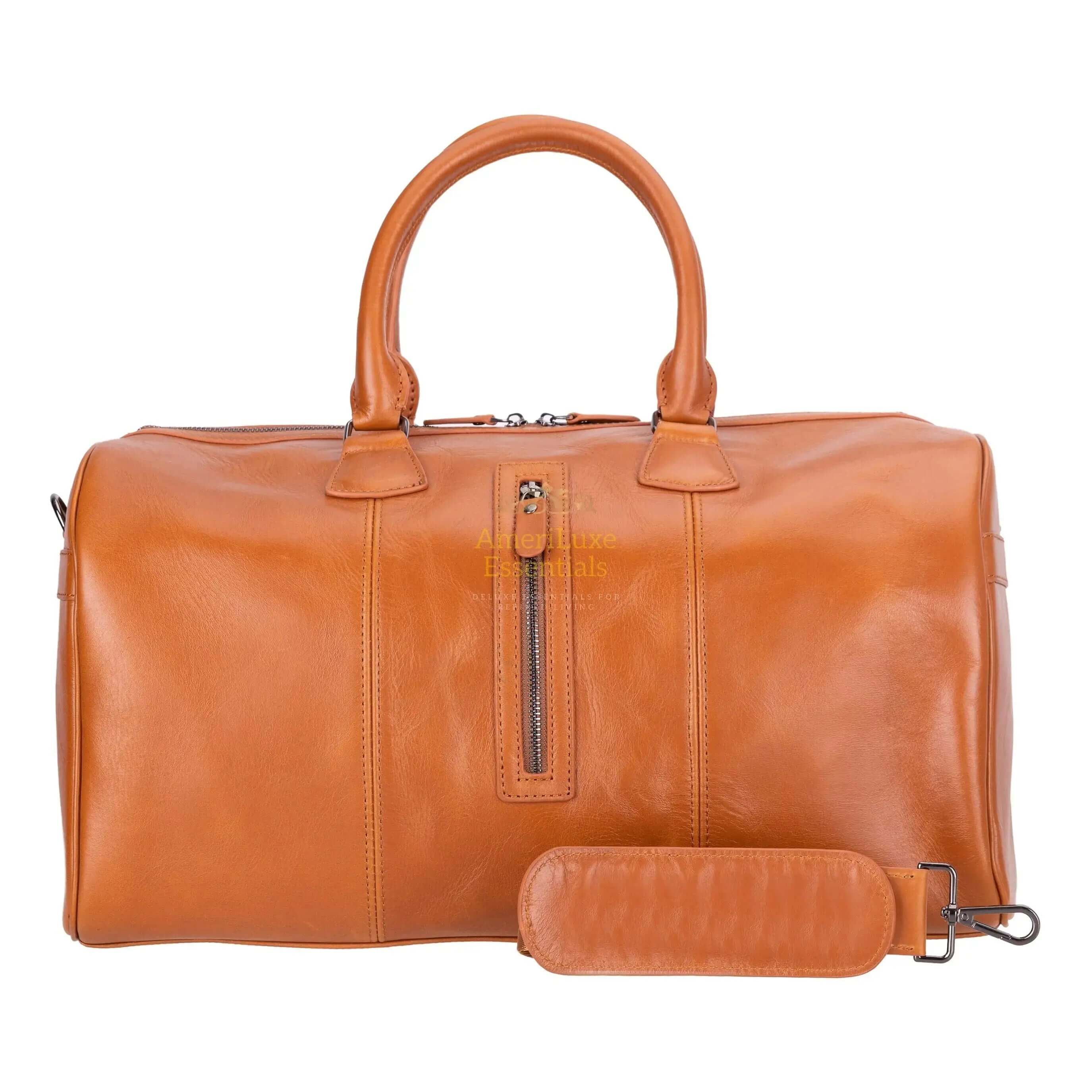 Atmore leather duffle bag in rich tan color with top handles and detachable strap.