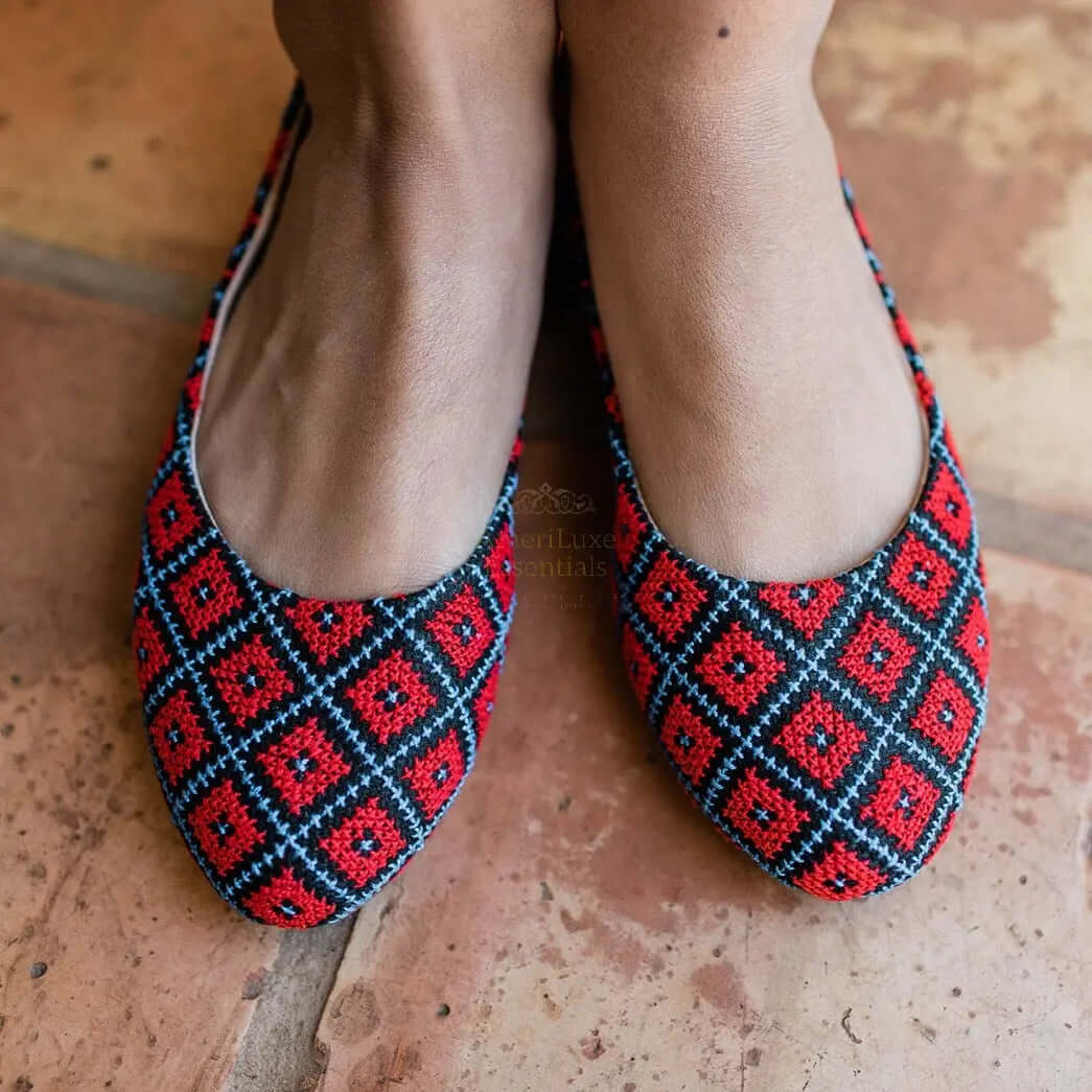 Yasmin Cardinal Red Comfortable Flat Shoes with traditional tatreez embroidery design worn on a person's feet.