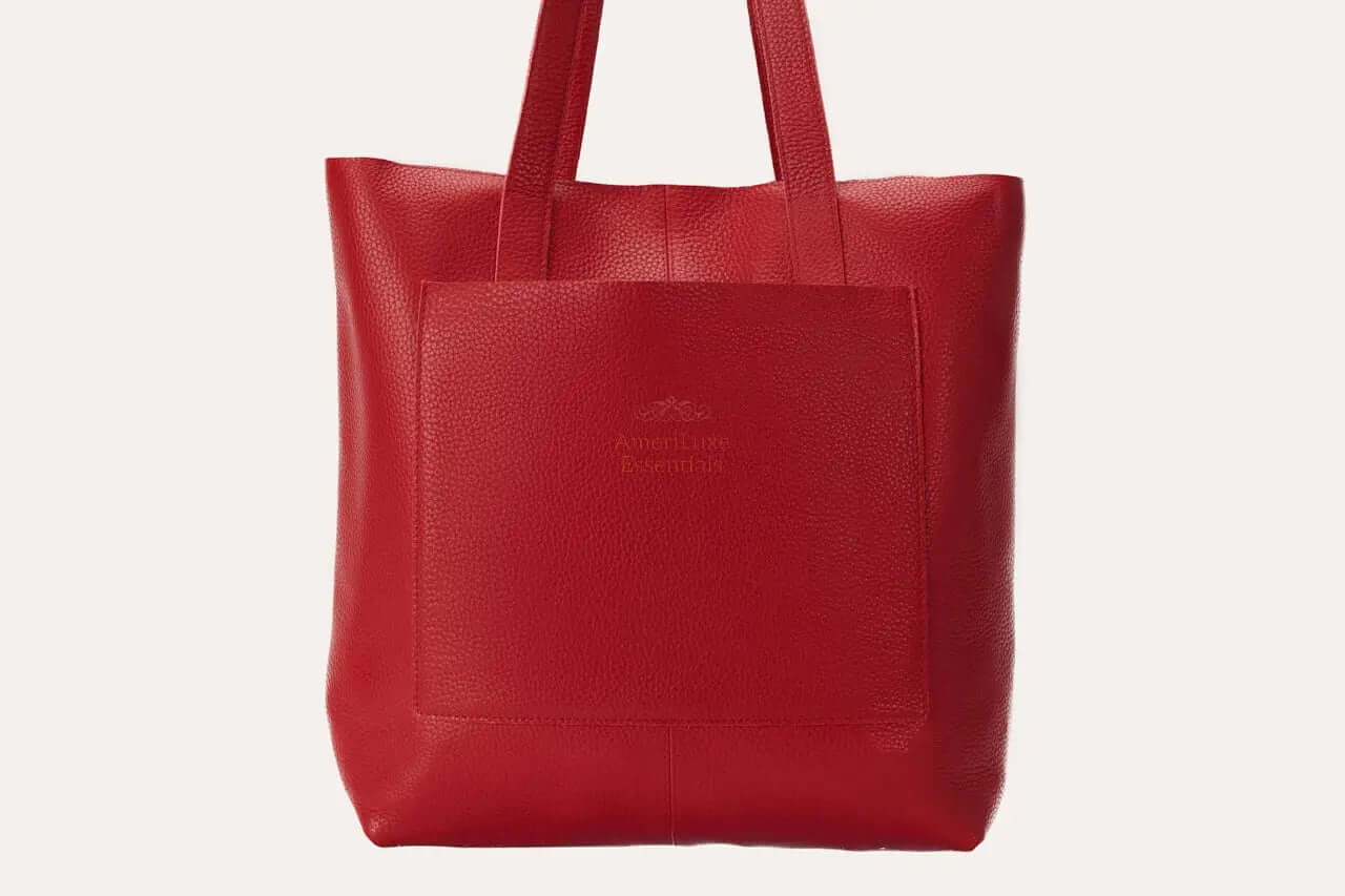 Professional journalist tote bag in red top grain cowhide leather with soft texture and exterior pocket.