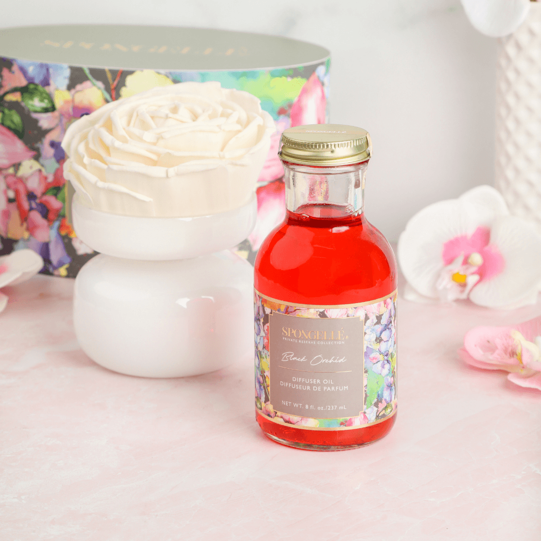Black Orchid - Private Reserve Diffuser with floral packaging and luxurious diffuser oil on a decorative surface.