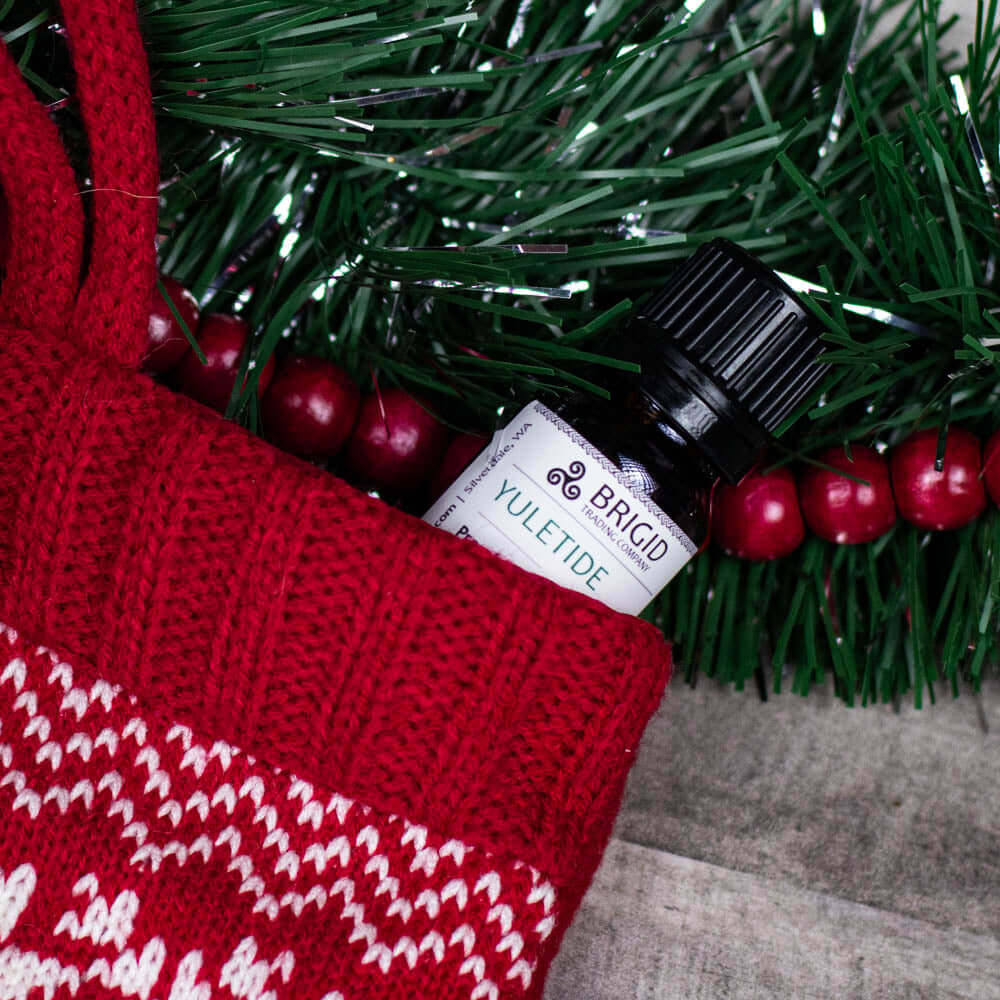 Diffuser Oil Blends - Essential and Premium Fragrance Blends in a festive red stocking with holly and greenery.