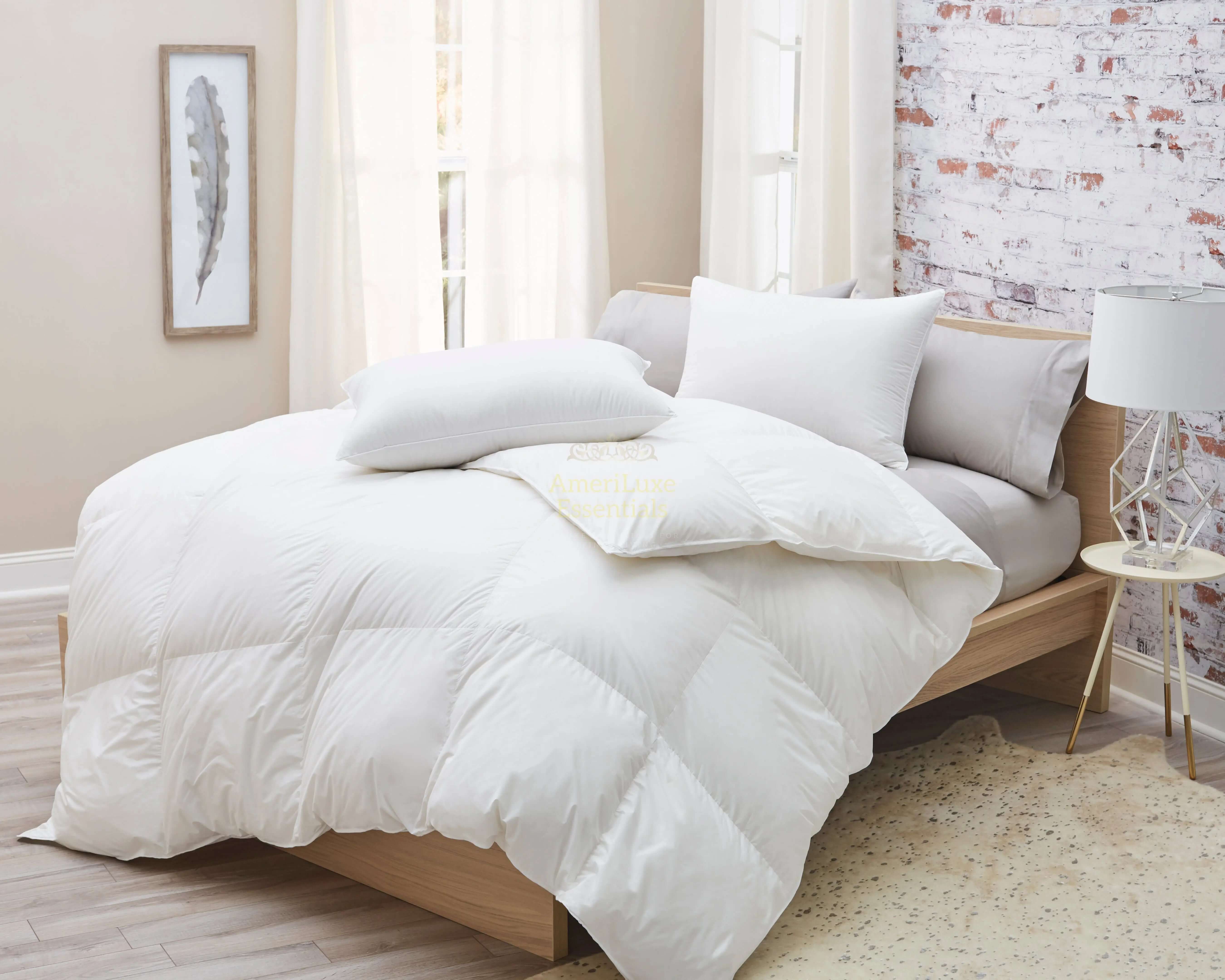 Premium white goose down comforter on a stylish bed with soft pillows, featuring a light and airy aesthetic.