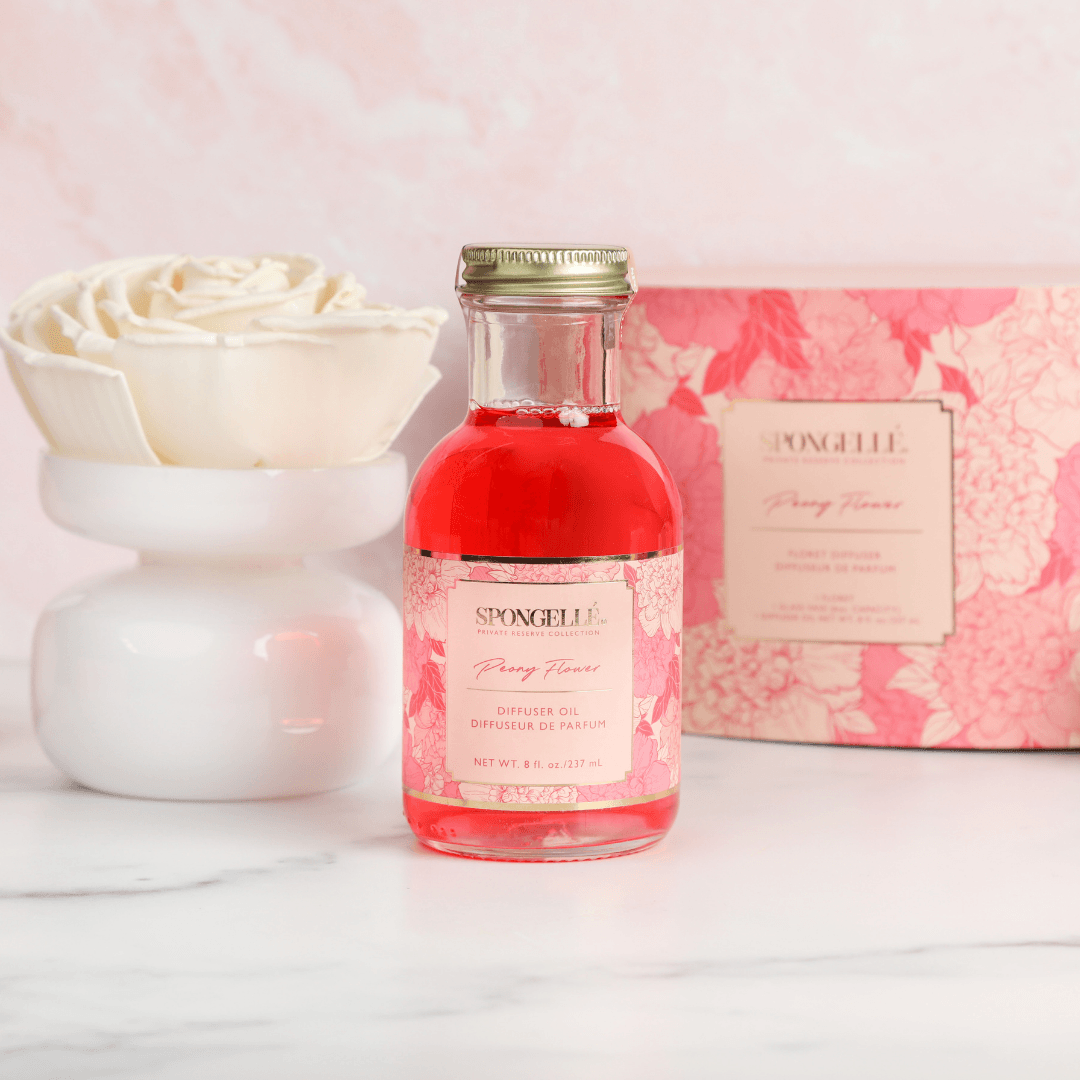 Peony Flower - Private Reserve Diffuser in a decorative bottle with floral packaging and a ceramic holder.