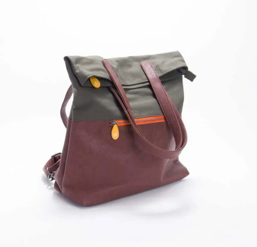 Greenpoint convertible backpack purse in olive green and burgundy with adjustable straps and zipper pocket.