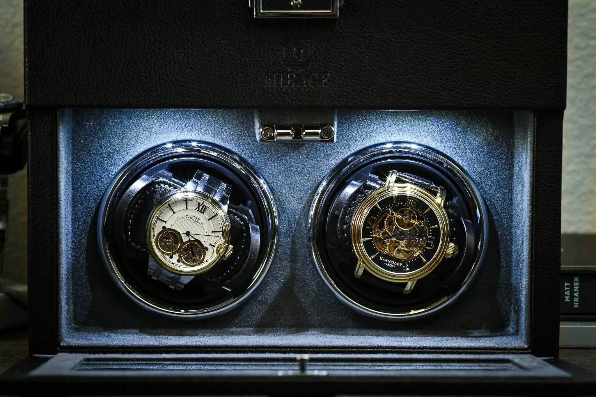 Luxury Watch Winder Box - Ebony Black showcasing automatic watches in elegant storage compartments.