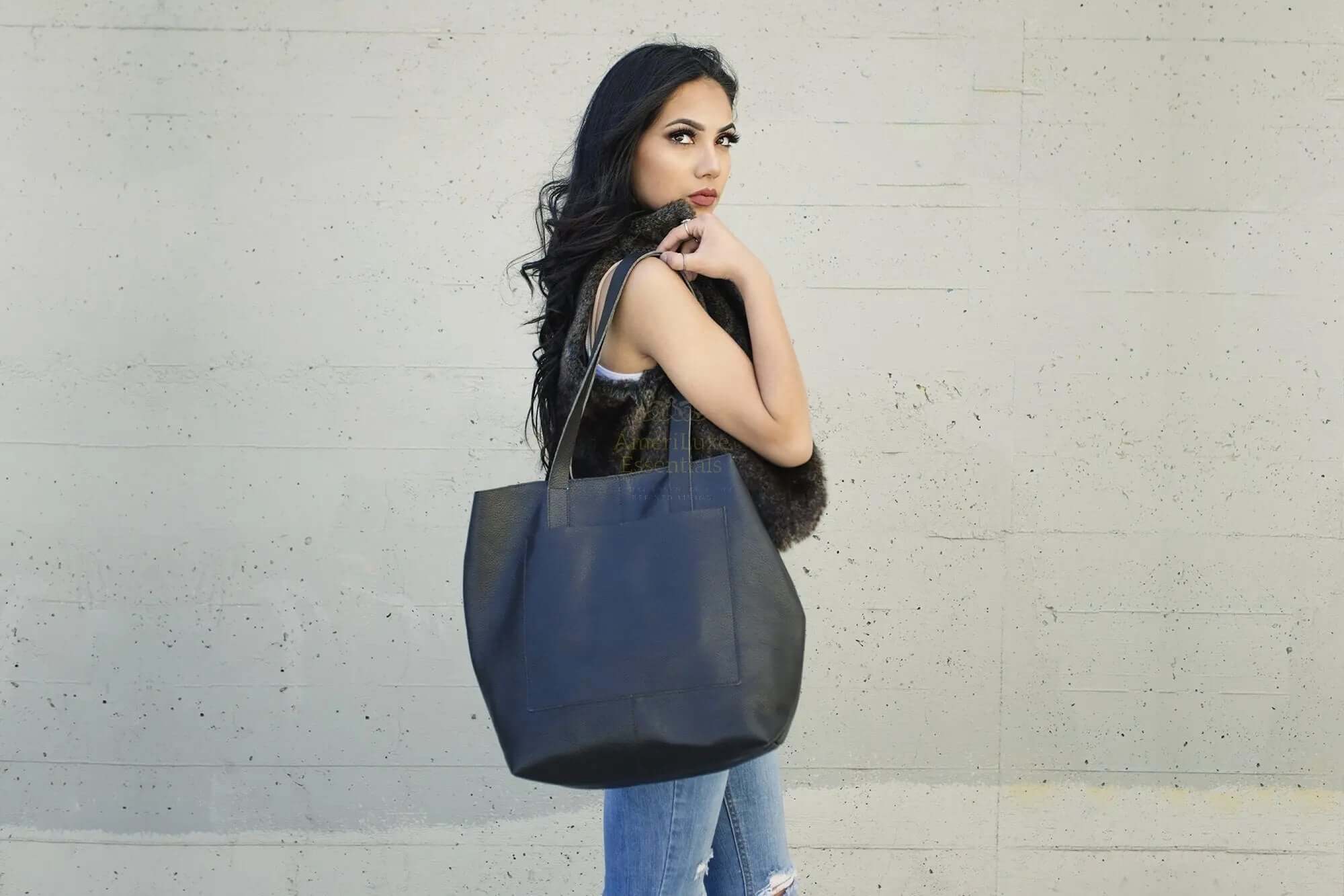 Woman modeling a stylish professional journalist tote bag against a neutral background.