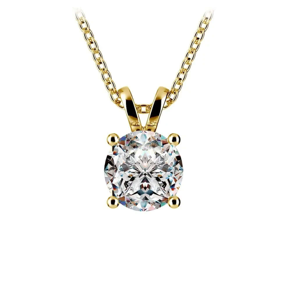 Lab grown diamond pendant in yellow gold with round diamond on a delicate chain.