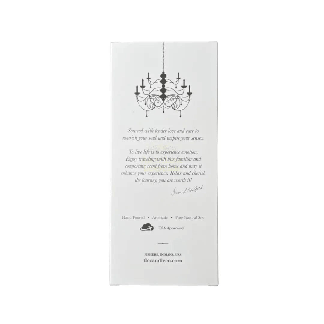 Coastal travel scented candles box back view with chandelier graphic and soothing descriptions.