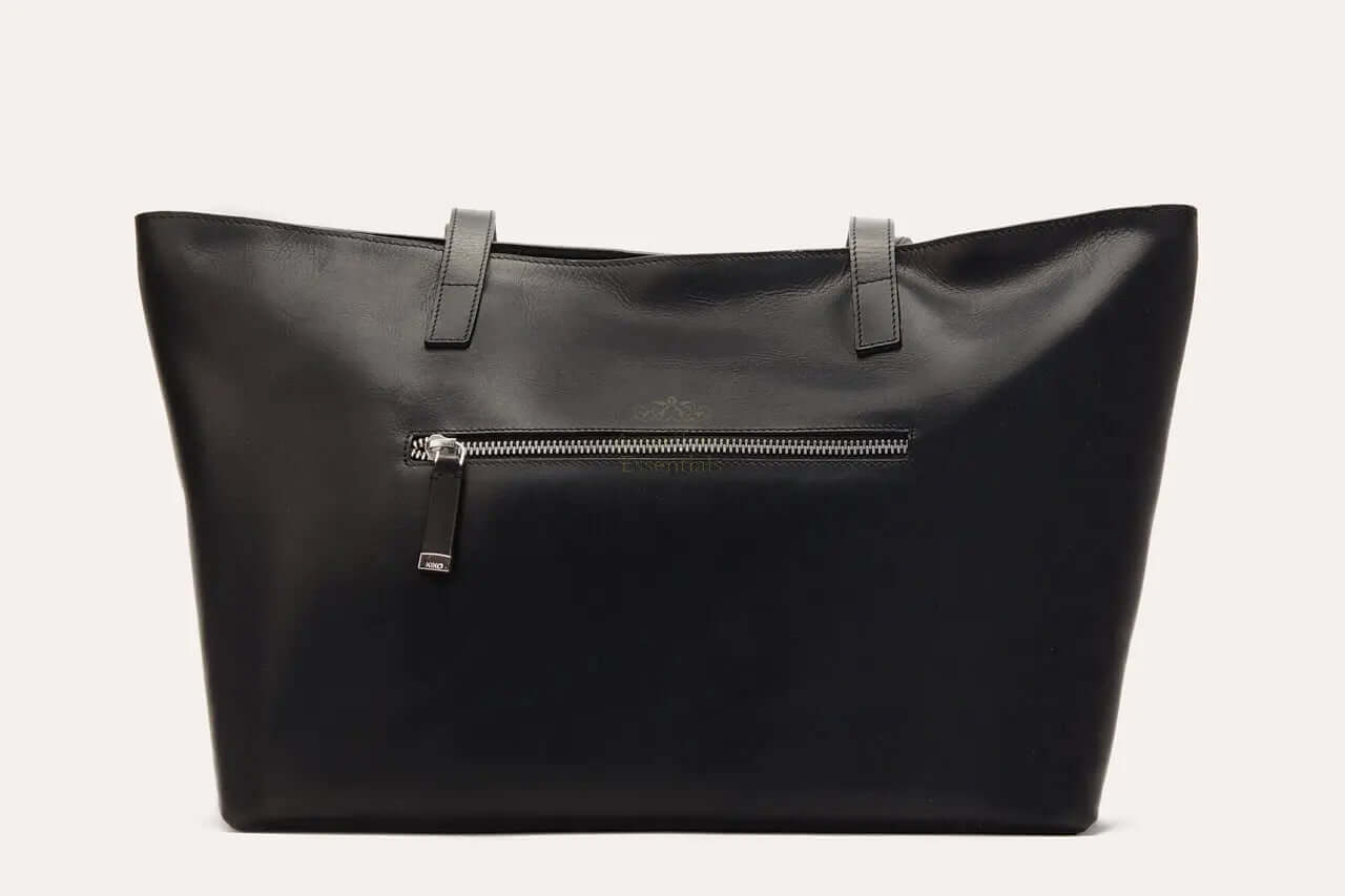 Mid Zip Tote Bag in black genuine leather featuring a top zip closure and an external zipper pocket.