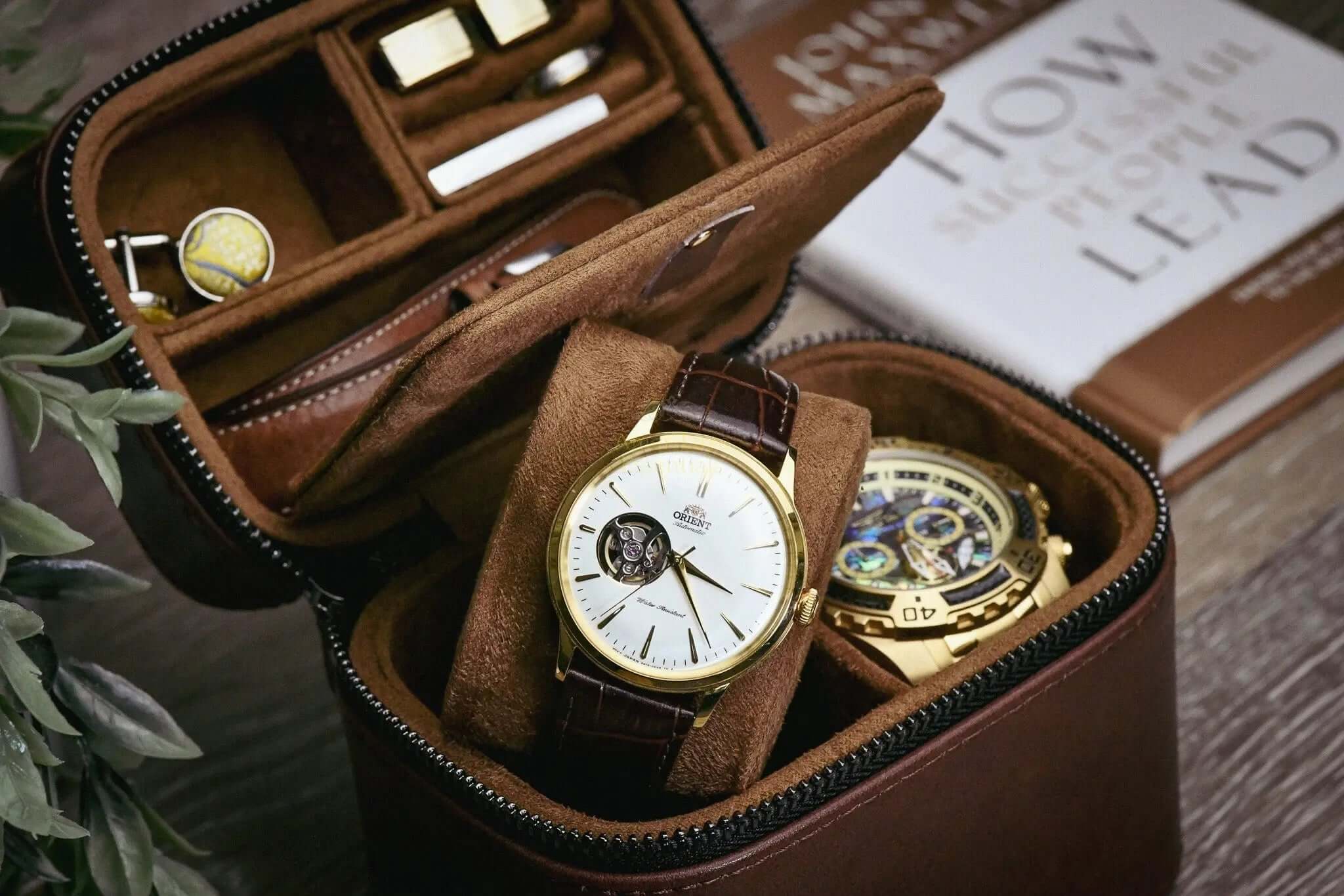 leather watch travel case with two watches and compartments for accessories in coffee brown color
