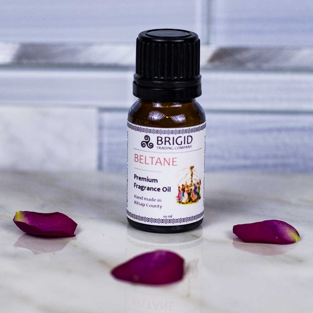 Diffuser Oil Blends - Essential and Premium Fragrance Blends featuring Brigid's Beltane Premium Fragrance Oil bottle with rose petals.