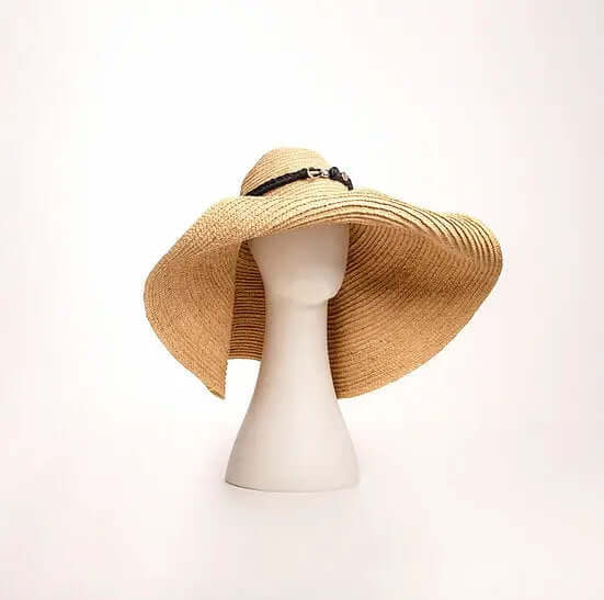 Sonder and Holliday Grand Belmont sun hat displayed on a mannequin with a wide brim and stylish design.