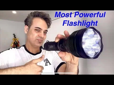 Individual holding the Destroyer-X10K 9500 lumen search light showcasing its features and power.