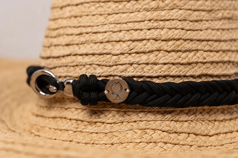 Close-up of the braided black hatband on the Grand Belmont sun hat by Sonder and Holliday.