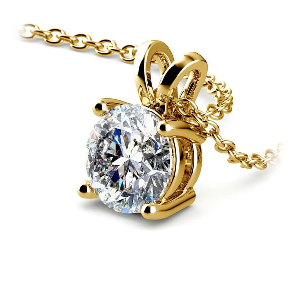 Lab grown diamond pendant in yellow gold with round diamond in prong setting, showcasing exquisite craftsmanship.