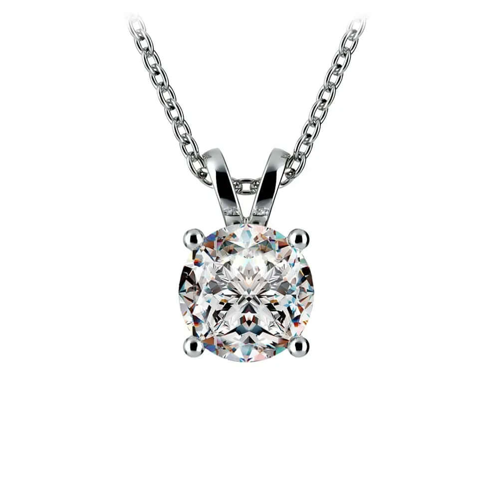 Lab grown diamond pendant with a round cut diamond in a prong setting on a silver chain.